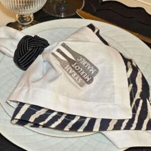 White cotton napkin with wine bottle embroidery